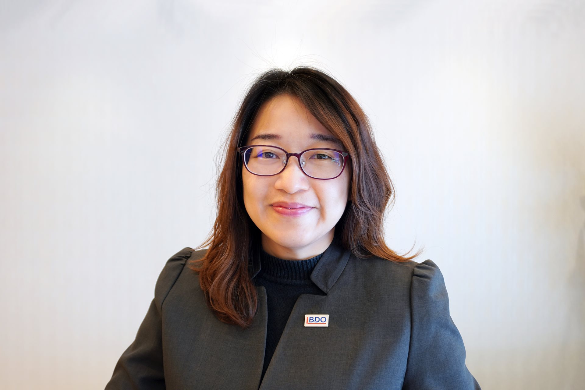 Iris Tan , Executive Director, Advisory 
